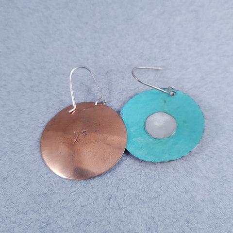 D1/10034  Silver and copper earring with patina.